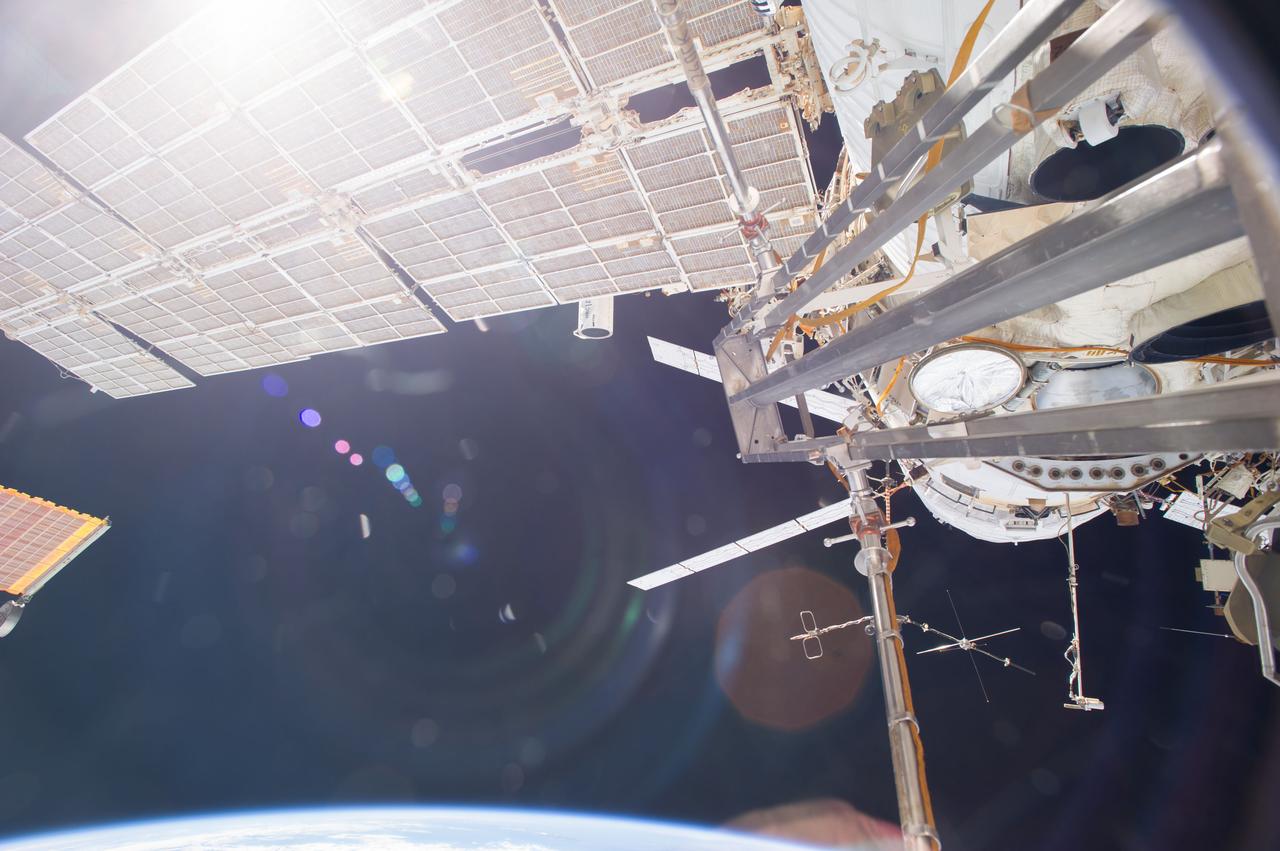 ISS040-E-123168 (2 Sept. 2014) --- A portion of the International Space Station’s Russian segment is pictured in this image photographed by an Expedition 40 crew member onboard the station. A portion of the "Georges Lemaitre" Automated Transfer Vehicle-5 (ATV-5) docked to the Zvezda Service Module is visible at right background.