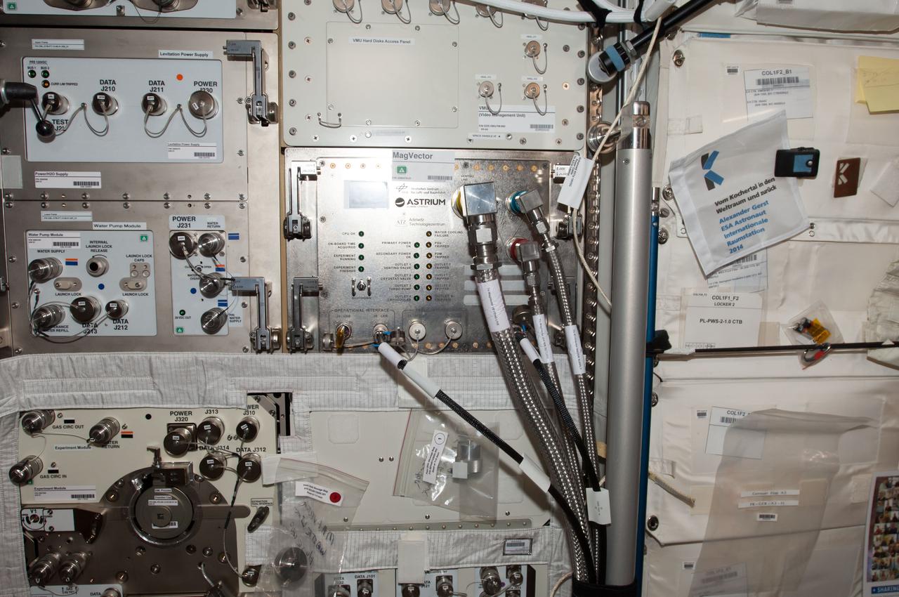 iss040e123621 (9/4/2014) --- Photographic documentation of final installation of MAGVECTOR hardware in the Columbus module aboard the International Space Station (ISS). MAGVECTOR qualitatively investigates the interaction between a moving magnetic field and an electrical conductor. The set up will provide initial insights regarding the principal feasibility on board the ISS,future improvements and phenomenological trends and dependencies. The expected changes in the magnetic field structure on the Ram and Wake side of the electrical conductor are of interest for technical applications as well as for astrophysical research.