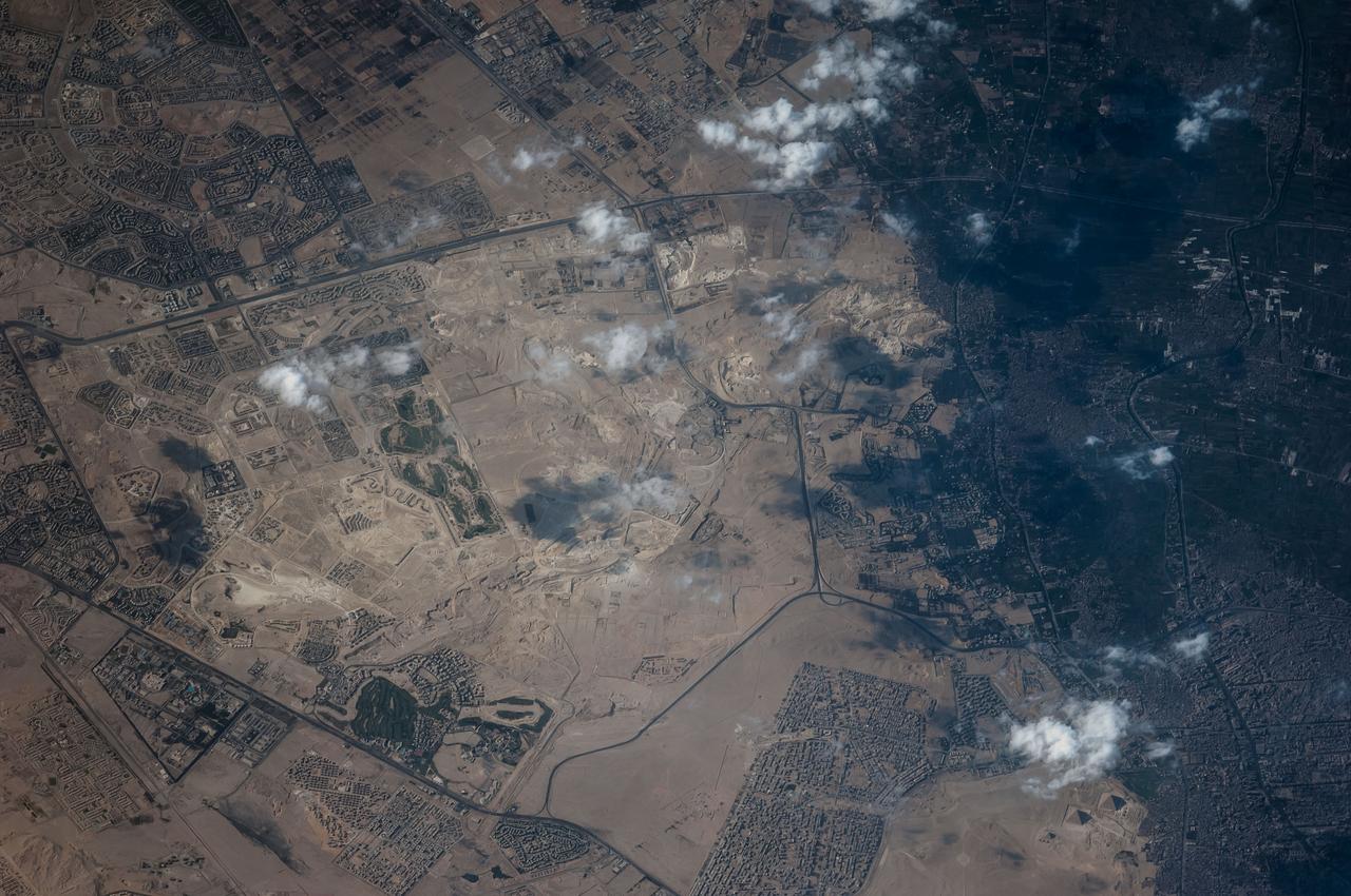 ISS040-E-124097 (5 Sept. 2014) --- A close look in the lower right corner of this photograph of Egyptian land near Cairo reveals three pyramids making up the Pyramids of Giza which have a history dating back over two millennia B.C.  One of the Expedition 40 crew members aboard the International Space Station recorded the image on Sept. 5, 2014.