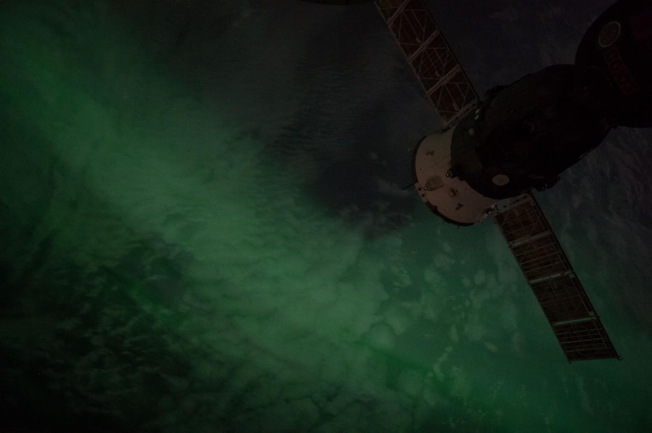 Earth Observation taken during a night pass by the Expedition 40 crew aboard the International Space Station (ISS). Folder lists this as: New Zealand Aurora night pass. On crewmember's Flickr page - Look straight down into an aurora.