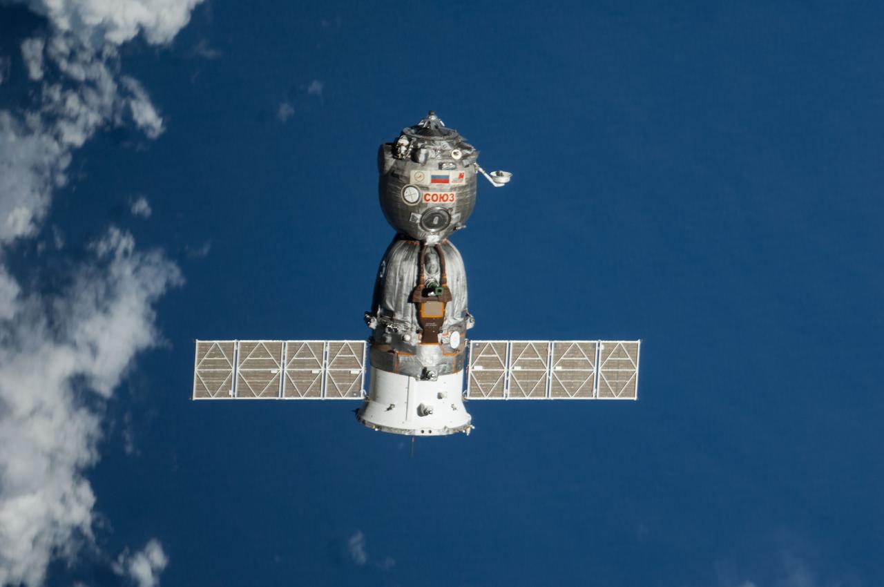 ISS041-E-000027 (10 Sept. 2014) --- The Soyuz TMA-12M spacecraft departs from the International Space Station and heads toward a landing in a remote area near the town of Zhezkazgan, Kazakhstan. NASA astronaut Steve Swanson, Expedition 40 commander; Russian cosmonaut Alexander Skvortsov, Soyuz commander and flight engineer; and Russian cosmonaut Oleg Artemyev, flight engineer, are returning from more than five months aboard the space station where they served as members of the Expedition 39 and 40 crews. Landing occurred at 10:23 p.m. (EDT), Sept. 10, 2014 (8:23 a.m., Sept. 11, Kazakh time).