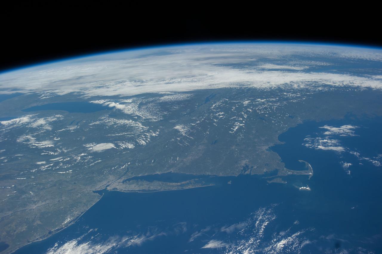 ISS041-E-016907 (17 Sept. 2014) --- Much of northeastern USA is visible in the bottom of this frame and a large portion of the Great Lakes area is visible near center and top in this oblique photographed taken by one of the Expedition 41 crew members aboard the International Space Station n Sept. 17. A 38mm focal length was used to record several pictures in this sequence as the orbital outpost was flying 221 miles above the Atlantic Ocean.