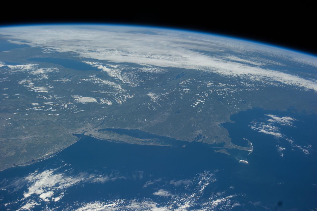 ISS041-E-016908 (17 Sept. 2014) --- Much of northeastern USA is visible in the lower land mass in this frame and a large portion of the Great Lakes area is visible near center and top in the oblique photograph taken by one of the Expedition 41 crew members aboard the International Space Station on Sept. 17. A 38mm focal length was used to record several pictures in this sequence as the orbital outpost was flying 221 miles above the Atlantic Ocean.