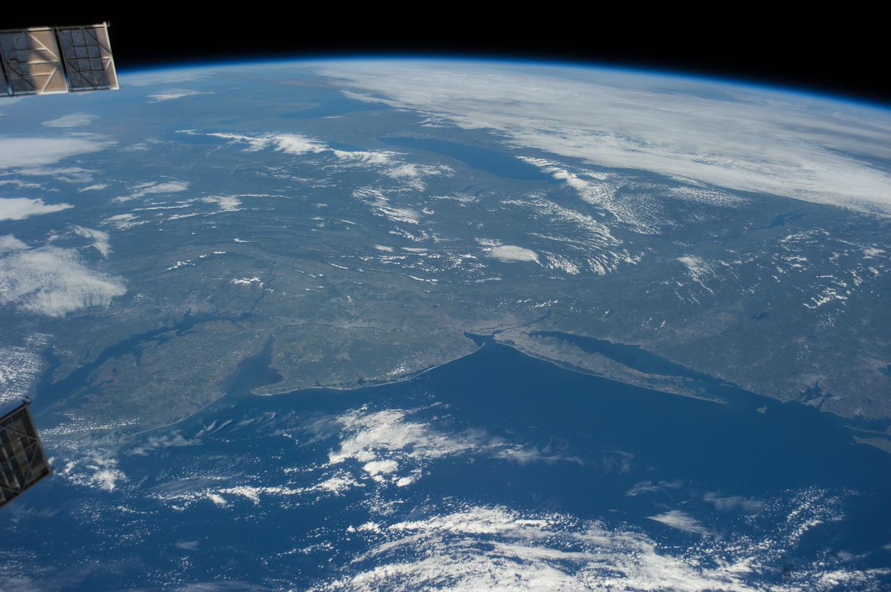 ISS041-E-016909 (17 Sept. 2014) --- Much of northeastern USA is visible in the lower land mass in this frame and a large portion of the Great Lakes area is visible near center and top in the oblique photograph taken by one of the Expedition 41 crew members aboard the International Space Station on Sept. 17. A 38mm focal length was used to record several pictures in this sequence as the orbital outpost was flying 221 miles above the Atlantic Ocean.