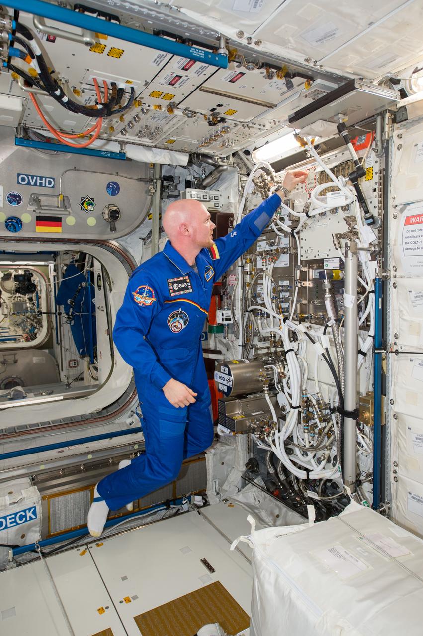 iss041e107733 (11/4/2014) --- ESA astronaut Alexander Gerst activates the Electromagnetic Levitator (EML), a microgravity furnace for metals, inside Europe's Columbus module of the International Space Station during his 2014 Blue Dot mission.