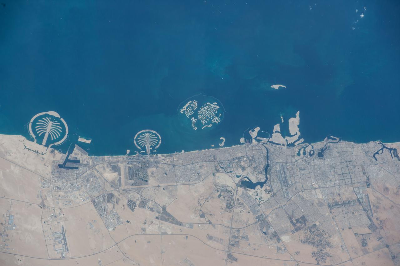 Earth observation taken by the Expedition 42 crew aboard the ISS. Palm and World Islands, United Arab Emirates. Image was released by astronaut on Instagram.