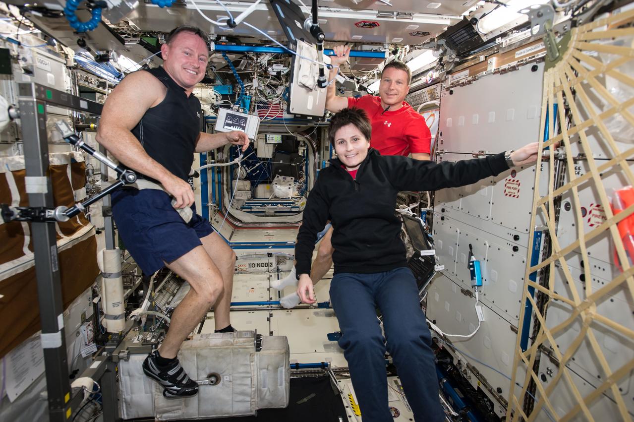 ISS042E016676 (11/27/2014) --- Expedition 42 Commander Barry Wilmore of NASA, Flight Engineer Samantha Cristoforetti of the European Space Agency and Flight Engineer Terry Virts of NASA (left to right) are living and working on the International Space Station, performing hundreds of research investigations and maintaining the orbital laboratory.