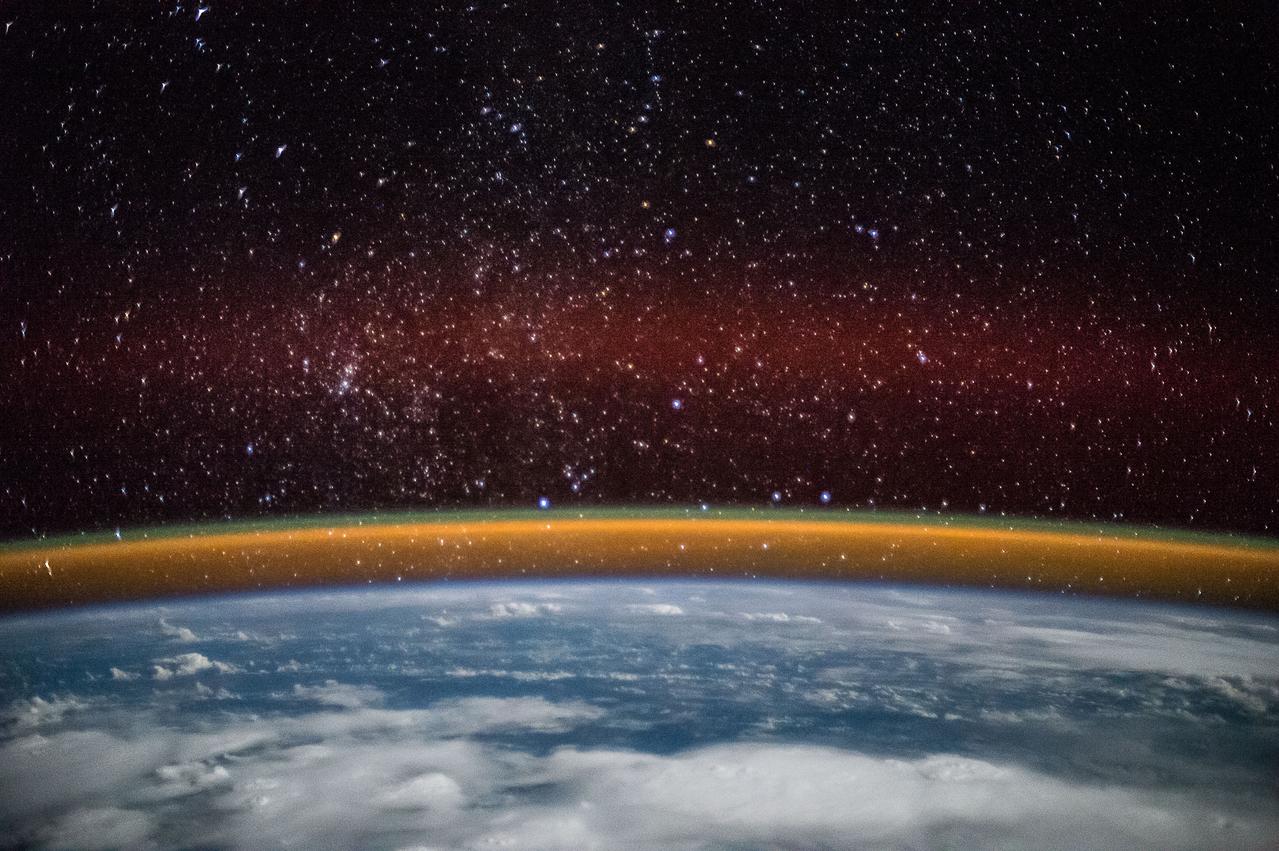 ISS042E037847 (12/15/2014) ---ESA (European Space Agency) astronaut Samantha Cristoforetti captured this image while on the International Space Station. It shows cloud cover over England, Baltic Sea and the Persian Gulf. It also displays a golden aurora with a splash of red through the stars during the night of Dec. 15, 2014.