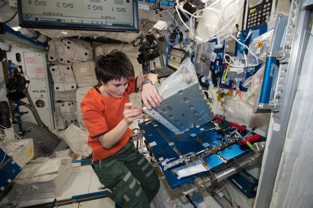 iss042e078210 (12/29/2014) --- European Space Agency Astronaut Samantha Cristoforetti aboard the International Space Station (ISS) on 29 December 2014, performs maintenance on a controller panel assembly in the Tranquility module. Life on board the ISS is one of constant maintenance and working with science experiments.