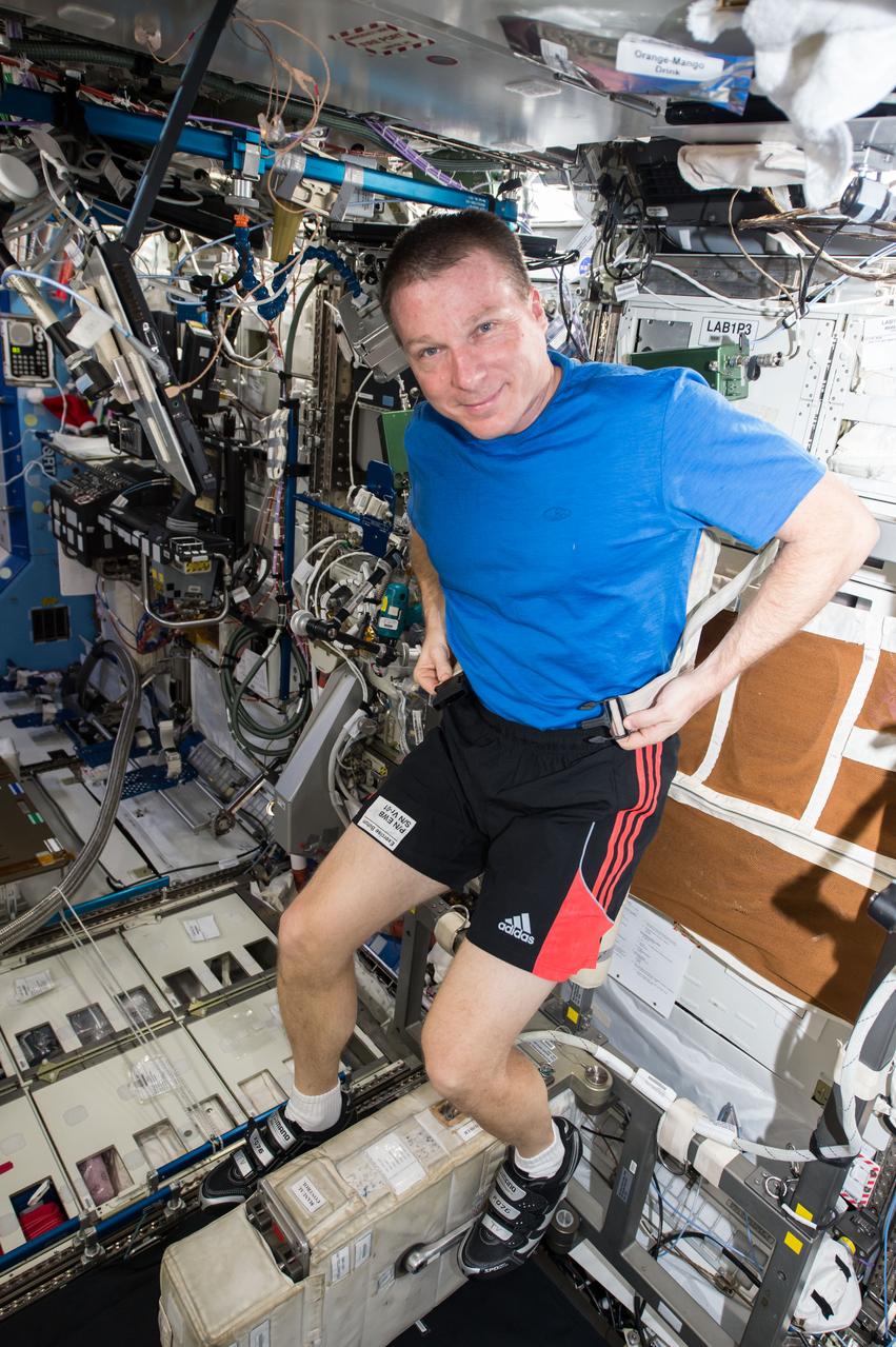 ISS042E082884 (12/27/2014) --- Expedition 42 Flight Engineer Terry Virts of NASA straps into the station’s stationary exercise bicycle known as the Cycle Ergometer with Vibration Isolation System (CEVIS). Each crew member spends an average of 2.5 hours a day exercising to combat the negative effects of prolonged weightlessness by maintaining bone and muscle mass and cardiovascular health.