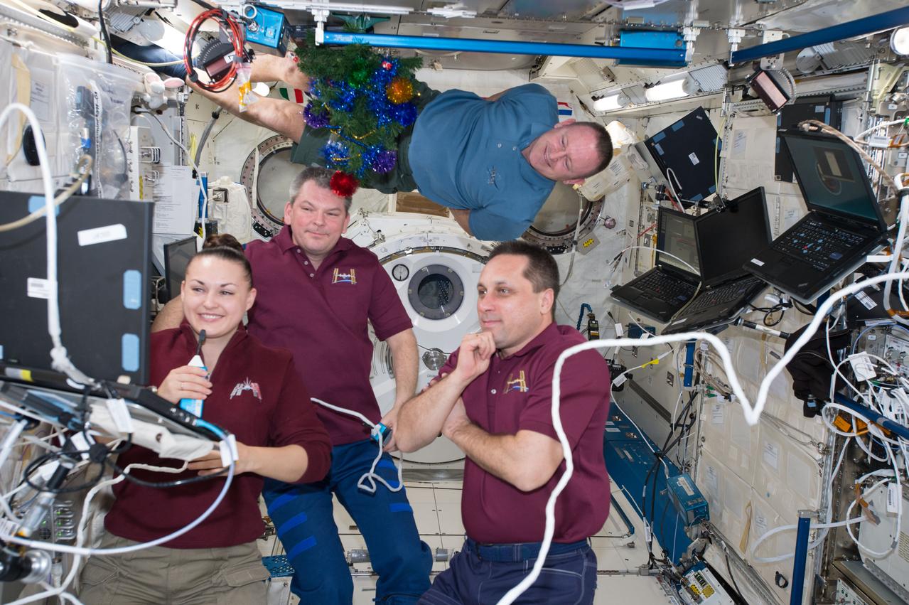 ISS042E101418 (01/07/2015) --- Expedition 42 Commander Barry Wilmore of NASA and Flight Engineers Elena Serova, Alexander Samoukutyaev and Anton Shkaplerov of Roscosmos are seen here gathered inside the Japanese Kibo module of the International Space Station working with equipment. Astronauts and Cosmonauts work a variety of science experiments and orbital maintenance while on their tour of duty aboard the ISS.