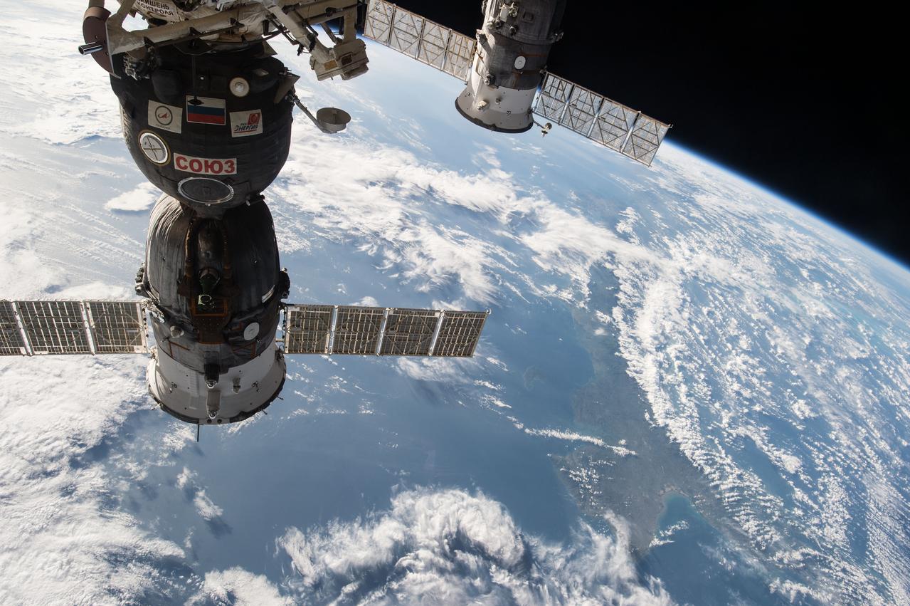 ISS042E101429 (01/05/2014) --- This image, photographed by one of the Expedition 42 crew members aboard the International Space Station, shows the  the Soyuz TMA-15M spacecraft on the left attached to the Rassvet module on the Earth-facing port of the Russian segment of the station that delivered Expedition 42 crewmembers Anton Shkaplerov of the Russian Federal Space Agency (Roscosmos), Terry Virts of NASA and Samantha Cristoforetti of the European Space Agency on Nov. 24, 2014 , and to the right, the unpiloted ISS Progress 57 cargo craft that is docked to the Pirs Docking Compartment and which arrived at the station a month earlier on Oct. 29, 2014.
