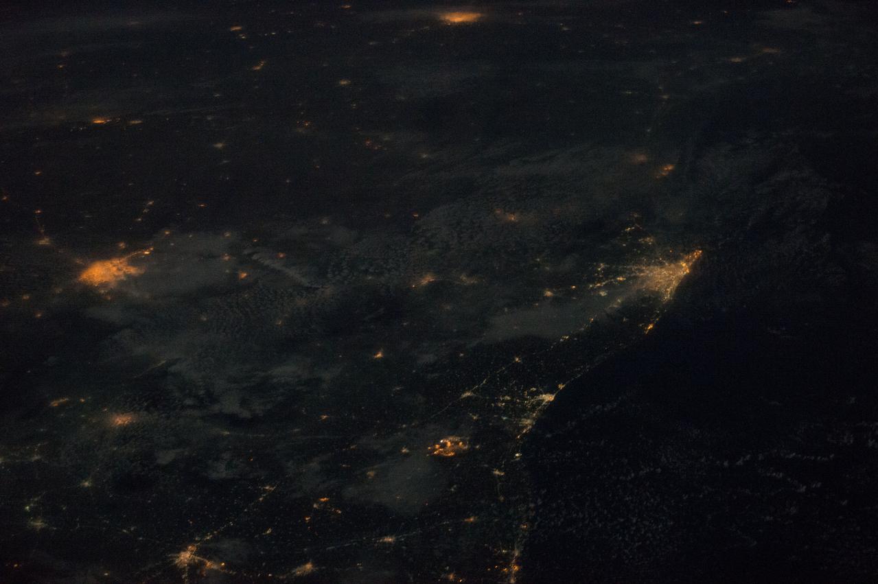 ISS042eE01551 (01/06/2015) --- NASA astronaut Terry Virts tweeted this night image out with the twinkling city lights of the coast of India and the Maldives. The Maldives is a tropical nation in the Indian Ocean composed of 26 coral atolls, which stretch for hundreds of islands. It’s known for its beaches, blue lagoons and extensive reefs. Terry tweeted this comment along with the image: " Moonlit clouds over southeast #India coastline, with Chennai, Bangalore, and Hyderabad."