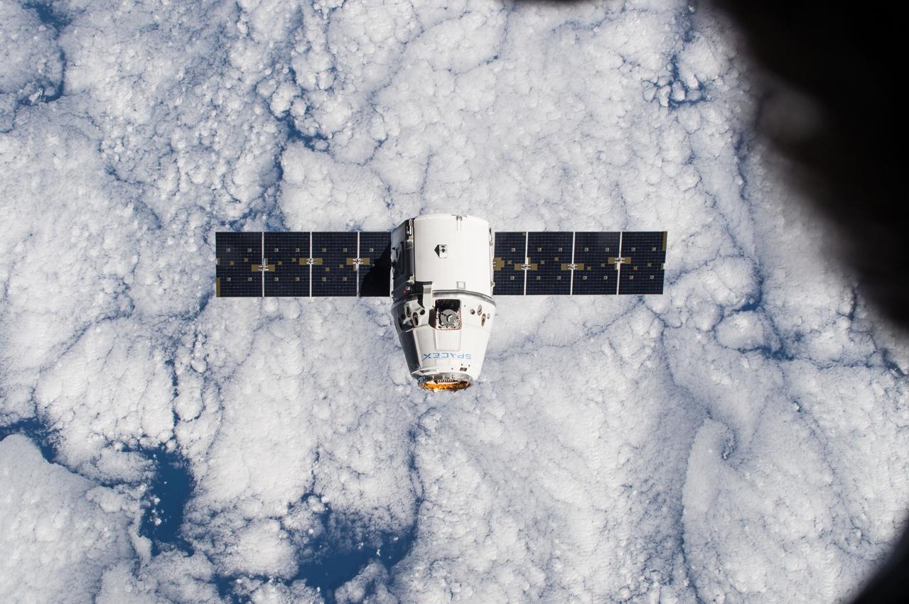 ISS042E119867(01/12/2015)--- This image, photographed by one of the Expedition 42 crew members aboard the International Space Station, shows the SpaceX Dragon cargo craft approaching on Jan. 12 2015 for its grapple and berthing and the start of a month attached to the complex. Dragon carried more than 2 ½ tons of supplies and experiments to the station.