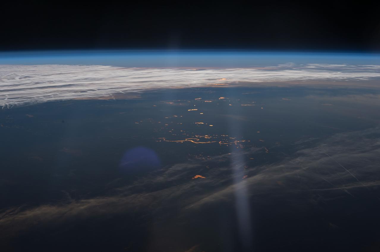 ISS042E230270 (02/06/2015) --- US NASA astronaut Terry Virts, Expedition 42 flight engineer on the International Space Station tweeted this Earth observation on Feb. 6, 2015 and made this comment: " Looking back over middle America at twilight. I love the sun’s reflection off these rivers and lakes".
