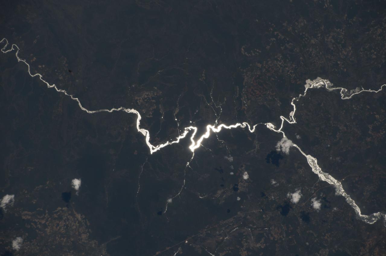 ISS042E237302 (02/09/2015) ---  Aboard the International Space Station on Feb. 9, 2015 NASA astronaut Terry Virts while viewing through the Cupola window captured this image of the African continent. Virts tweeted the photo to his many fans with the comment:  "Sun glint on one of a thousand rivers in the heart of #Africa, this one in #Angola" .