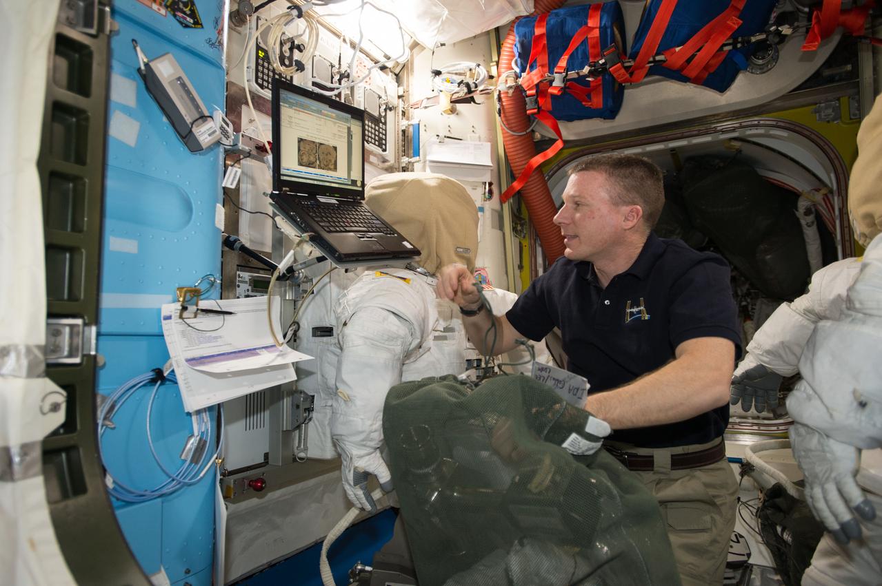 ISS042E238515 (02/10/2015) --- U.S. astronaut Terry Virts does a checkout of his spacesuit’s systems on Feb. 10, 2015 in preparation for an extravehicular activity (EVA) or spacewalk. Virts is a Flight Engineer of Expedition 42 onboard the International Space Station.