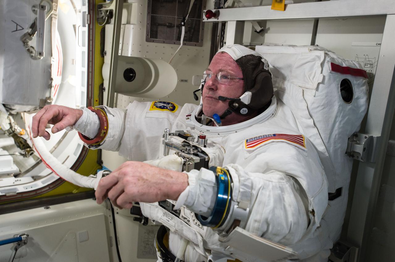 ISS042E277376 (02/16/2015) --- U.S. astronaut Barry "Butch" Wilmore checks out his spacesuit in preparation for an extravehicular activity (EVA) or spacewalk. Wilmore is the commander of Expedition 42 onboard the International Space Station.