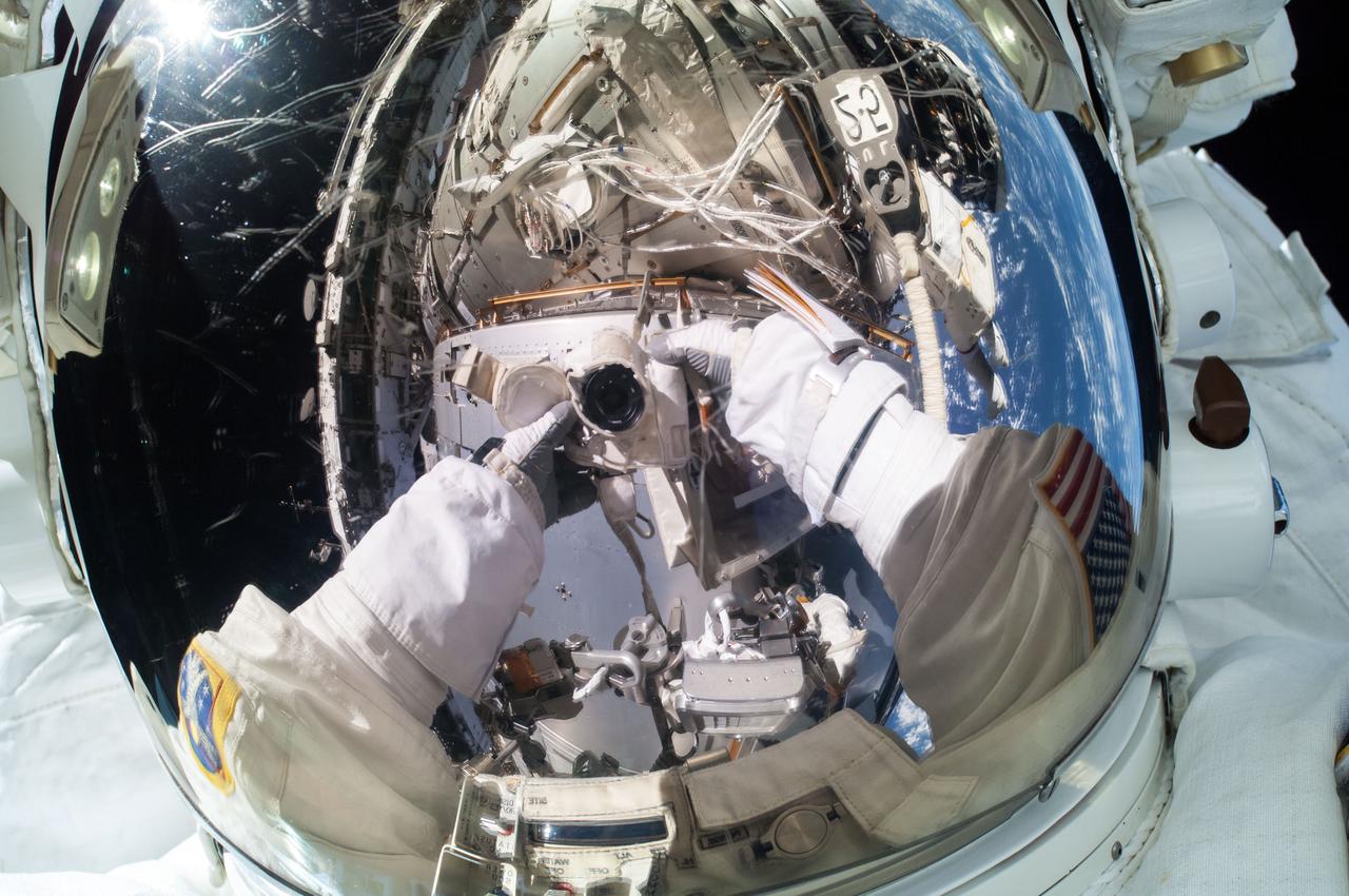 The camera is reflected in his helmet visor as Extravehicular crewmember 2 (EV2) Terry Virts takes a self-portrait during Extravehicular Activity 29 (EVA 29). Image was released by astronaut on Twitter.