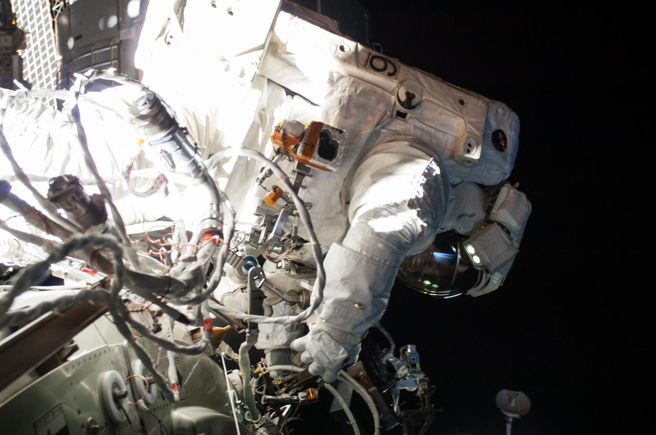 ISS042E288167 (02/25?2015) --- Expedition 42 astronauts Terry Virts and Barry “Butch” Wilmore worked outside the International Space Station installing cables and equipment Feb. 25, 2015 for the second of three spacewalks to help ready the laboratory complex for dockings by commercial crew capsules. Virts reported a small amount of water in his space helmet, but NASA officials said he was never in any danger