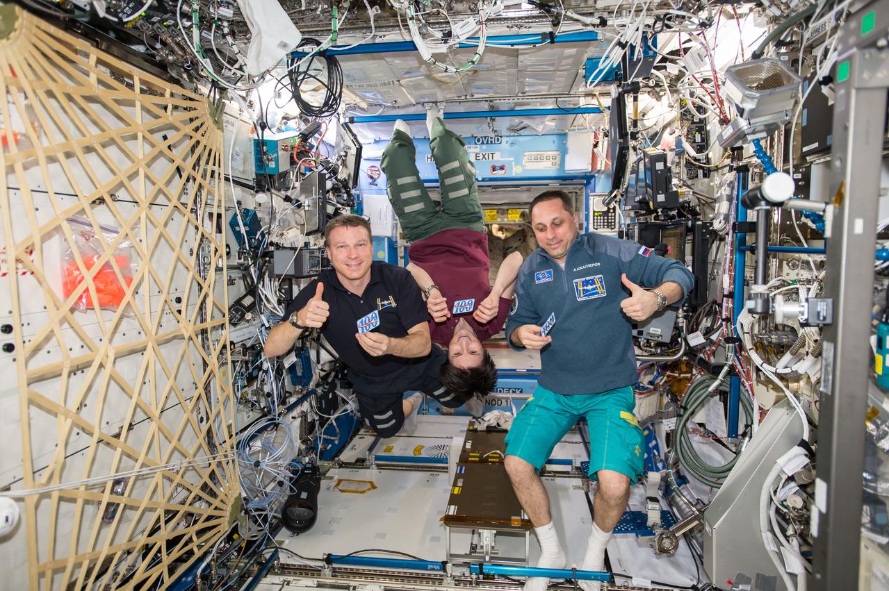 ISS042E296399 (03/02/2015) --- US astronaut Terry Virts, ESA (European Space Agency) astronaut Samantha  Cristoforetti and Russian cosmonaut Anton Shkaplerov acknowledge  their 100th day aboard the International Space Station  on Mar. 2, 2015 with this tweeted picture and the comment “Celebrating flight day 100 of our mission aboard the Station with @AstroSamantha and @AntonAstrey”.