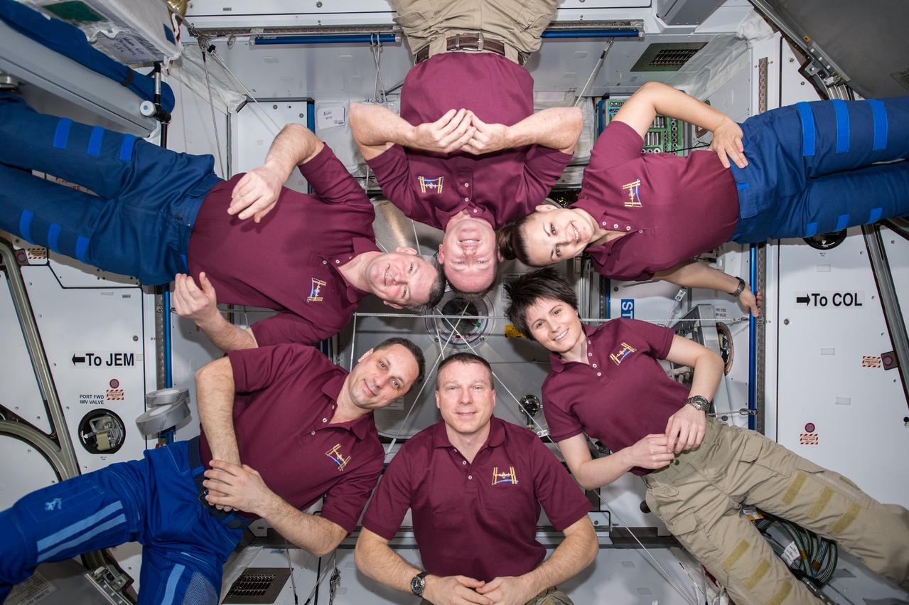 ISS042E306480 (03/07/2015) --- A meeting of the minds aboard the International Space Station on Mar. 7, 2015 with members of Expedition 42; astronauts US, Barry Wilmore (Commander) Top, Upside down, to the right cosmonaut Elena Serova, & ESA European Space Agency Samantha Cristoforetti. Bottom center US astronaut Terry Virts, top left cosmonauts Alexander Samokutyaev and Anton Shkaplerov.