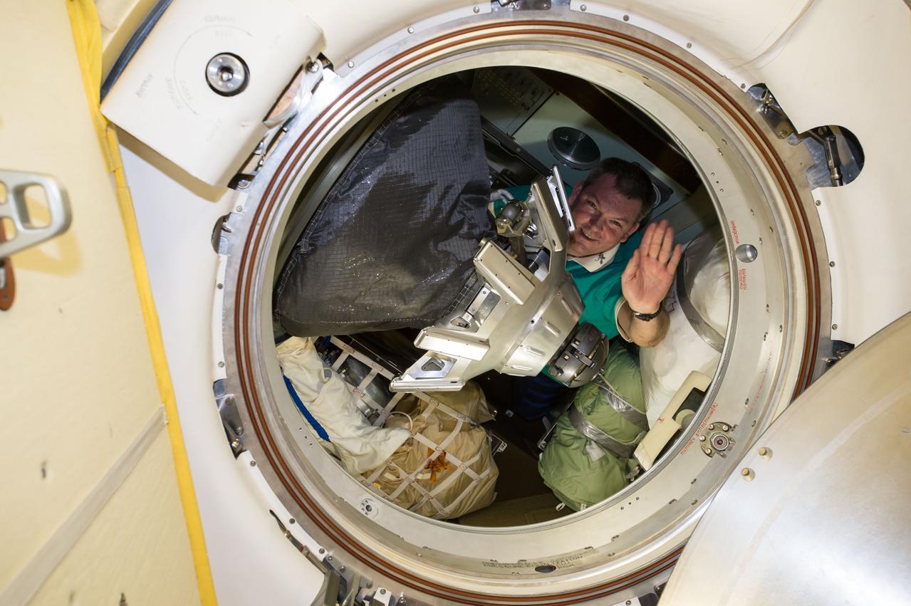 ISS042E325661 (03/11/2015) ---Three crew members of Expedition 42 prepare to return to Earth on Mar. 11, 2015 after a 167-day mission on the International Space Station. Expedition 42 commander Barry Wilmore of NASA and flight engineers Alexander Samokutyaev and Elena Serova of the Russian Federal Space Agency (Roscosmos) board the returning spacecraft. US NASA astronaut Terry Virts who will stay on as Commander of Expedition 43 tweeted this image of the crew boarding the Soyuz for the ride home. Cosmonaut Alexander Samokutyaev whose nickname is "Sasha" was last on. The Tweet had this comment "Sasha closing the hatch- пока Саш.".