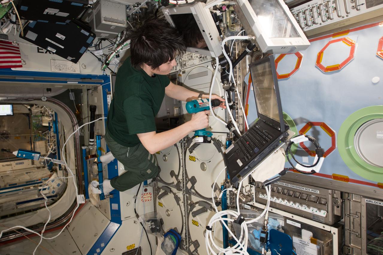    Photographic documentation of inspection and regular maintenance on Minus Eighty-degree Laboratory Freezer for the ISS 3 (MELFI-3) located in the LAB1S1 rack. View is of European Space Agency (ESA) astronaut Samantha Cristoforetti, Expedition 43 flight engineer, at work with the MELFI-3. 
