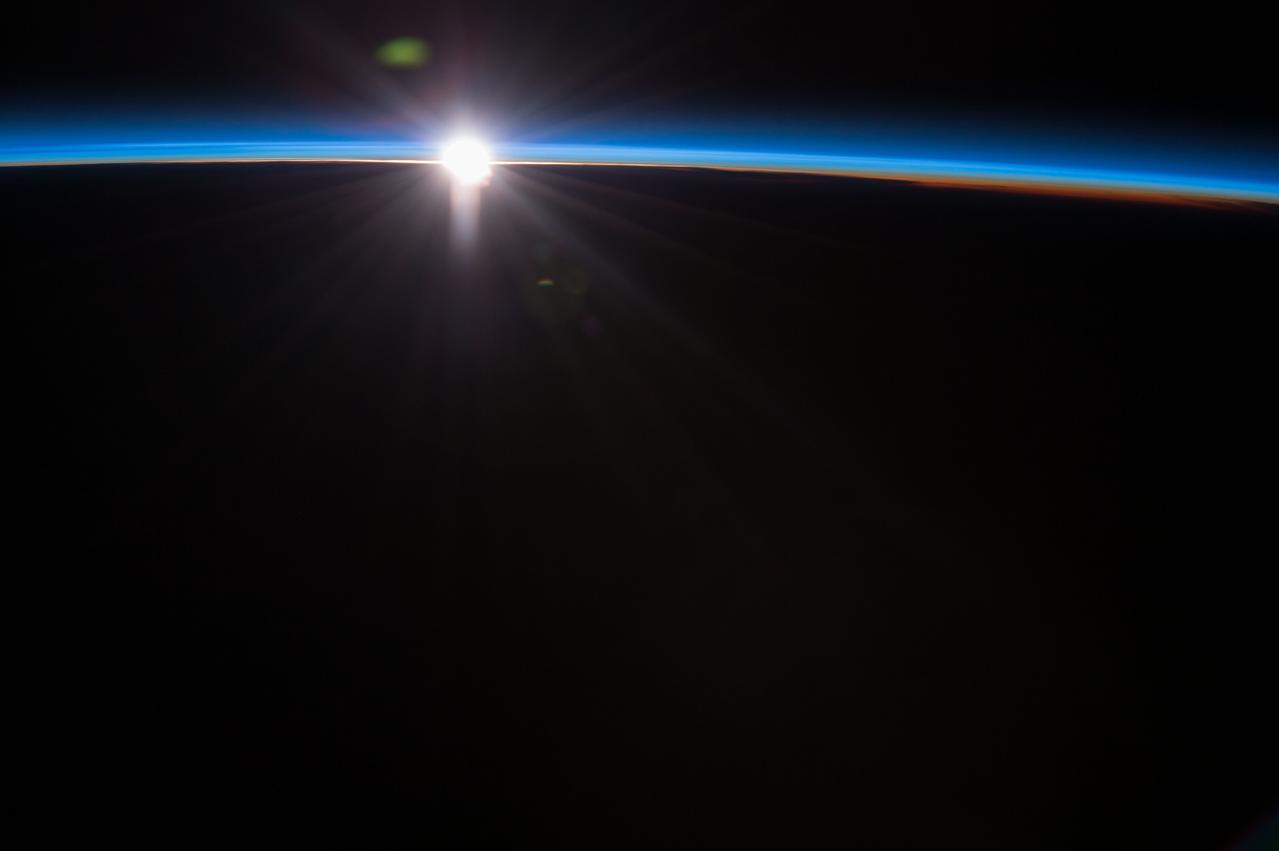 ISS043E032212 (03/19/2015) ---Aboard the International Space Station astronauts have spectacular views of our Earth. NASA Astronaut Terry Virts commander of Expedition 43 tweeted this comment with this image " Every #sunset is different, this one was blue".