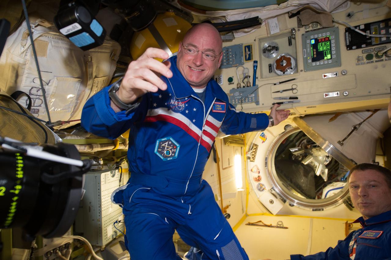 ISS043E059259 (03/28/2015) --- NASA astronaut Scott Kelly (left) is happy to be aboard the International Space Station after the hatch opening of the Soyuz spacecraft Mar. 28, 2015. Kelly traveled with Expedition 43 Russian cosmonauts Mikhail Kornienko and Gennady Padalka of the Russian Federal Space Agency (Roscosmos) on the Soyuz TMA-16M that launched Friday, March 27, 2015 from Baikonur, Kazakhstan. Kelly and Kornienko will spend a year in space and return to Earth on Soyuz TMA-18M in March 2016. Most expeditions to the space station last four to six months. By doubling the length of this mission, researchers hope to better understand how the human body reacts and adapts to long-duration spaceflight. This knowledge is critical as NASA looks toward human journeys deeper into the solar system, including to and from Mars.