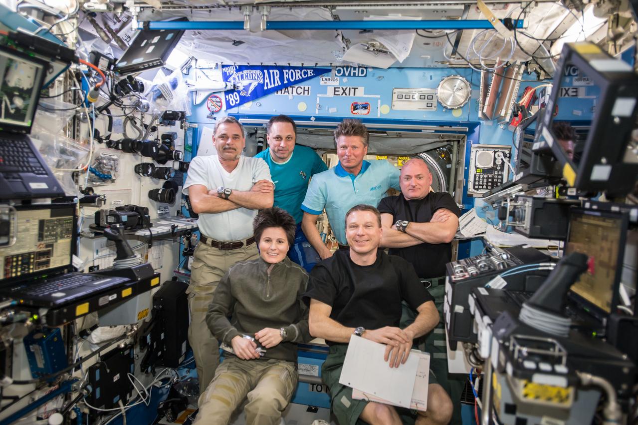 ISS043E069815 (03/30/2015) --- All six Expedition 43 crewmembers are gathered in the Destiny laboratory on board the International Space Station on Mar 30, 2015 after an emergency procedures training period. The six members include Russian cosmonauts Mikhail Kornienko (top left), Anton Shkaplerov, Gennady Padalka, NASA Astronaut Scott Kelly, ESA (European Space Agency) astronaut Samantha Cristoforetti (bottom left), and Expedition 43 commander US astronaut Terry Virts.