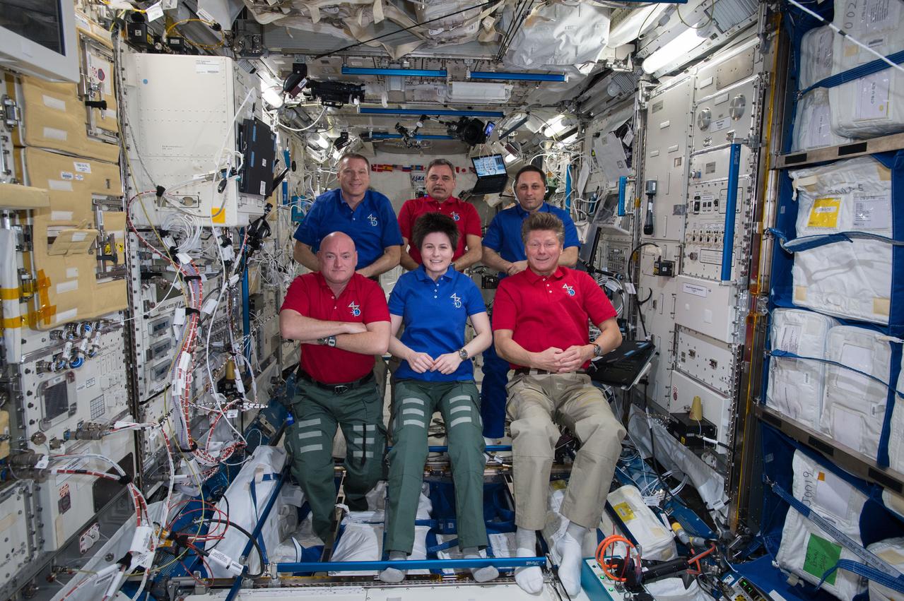 NASA astronaut Terry Virts, Commander of Expedition 43 on the International Space Station, is seen here recording a special message for a science conference along with his crewmates cosmonaut Mikhail Kornienko, Russian Federal Space Agency (ROSCOSMOS), ESA (European Space Agency) astronaut Samantha Cristoforetti, NASA Astronaut Scott Kelly (bottom left), Russian cosmonauts, Anton Shkaplerov, and Gennady Padalka (ROSCOSMOS).