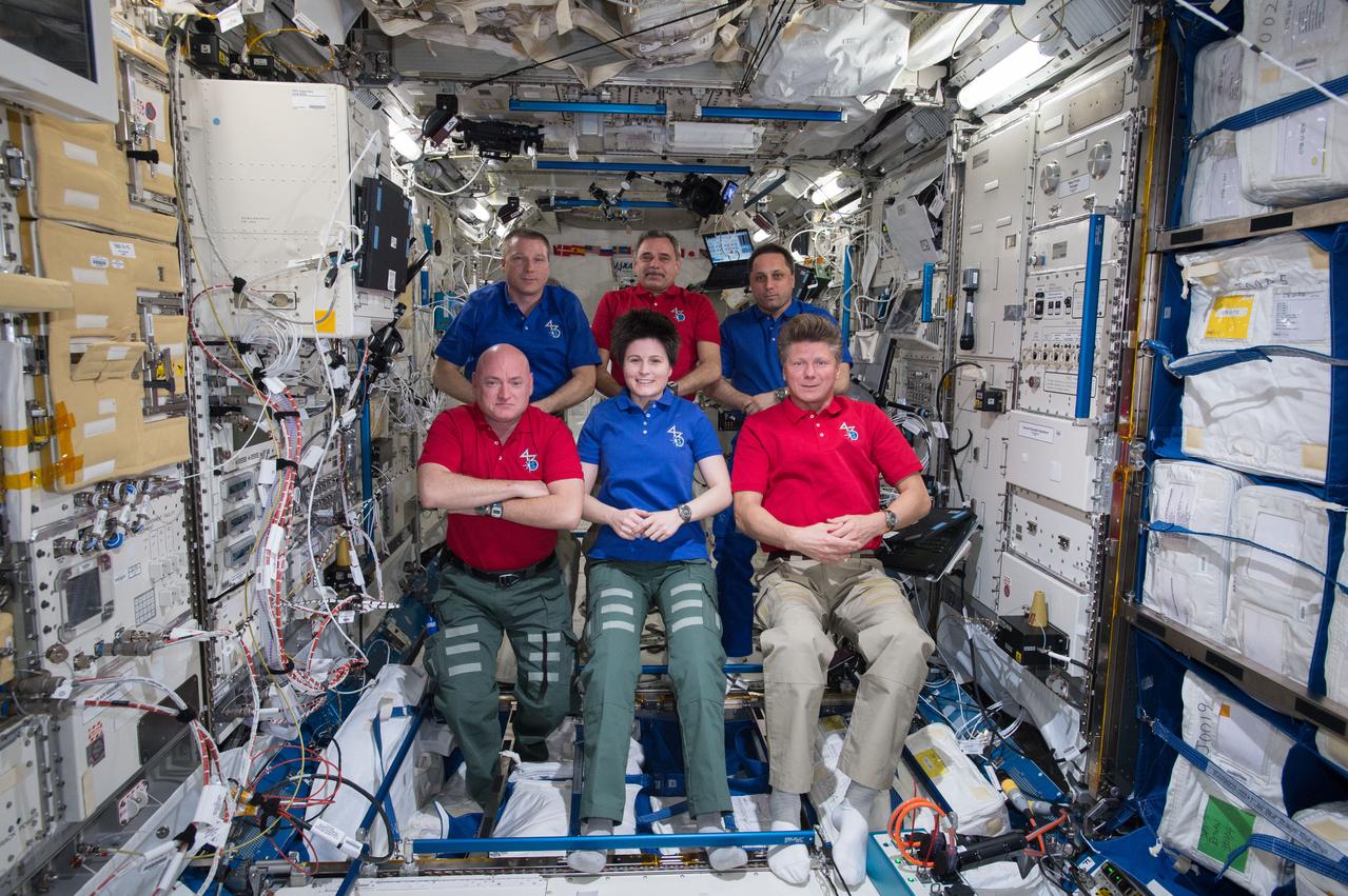 NASA astronaut Terry Virts, Commander of Expedition 43 on the International Space Station, is seen here recording a special message for a science conference along with his crewmates cosmonaut Mikhail Kornienko, Russian Federal Space Agency (ROSCOSMOS), ESA (European Space Agency) astronaut Samantha Cristoforetti, NASA Astronaut Scott Kelly (bottom left), Russian cosmonauts, Anton Shkaplerov, and Gennady Padalka (ROSCOSMOS).