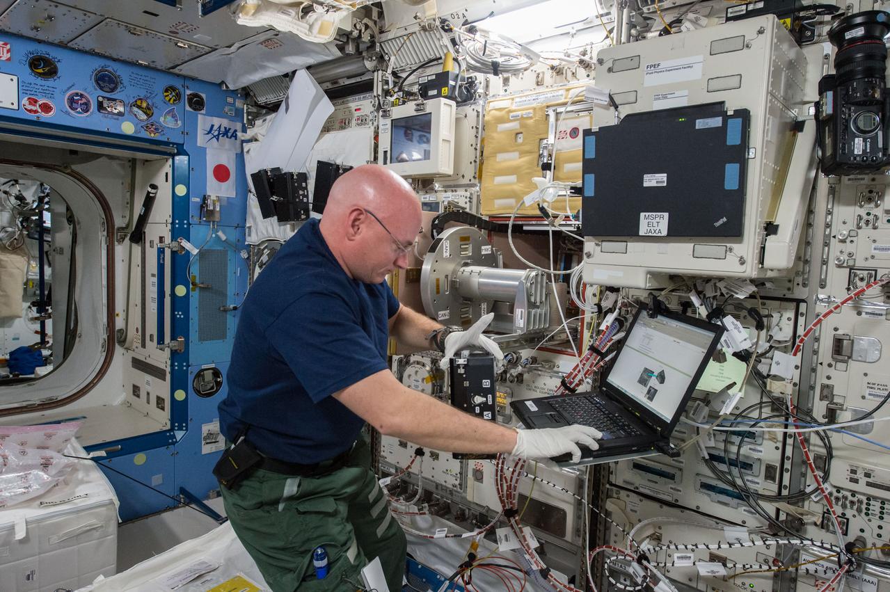 iss043e124063 (4/18/2015) --- NASA astronaut Scott Kelly is seen performing the Space Aging experiment using the Cell Biology Experiment Facility (CBEF) rack in the Japanese Experiment Module (JEM) aboard the International Space Station (ISS). The purpose of the experiment is to study the effects of weightlessness in space flight on the aging of the C. elegans roundworm, a model organism for a range of biological studies. Microgravity causes a number of physiological changes, like heart and bone deconditioning, involving mechanisms that are poorly understood and may affect the rate at which organisms and astronauts age. The Space Aging experiment will grow millimeter-long C. elegans roundworms in microgravity and compare their health and longevity with controlled specimens on Earth.