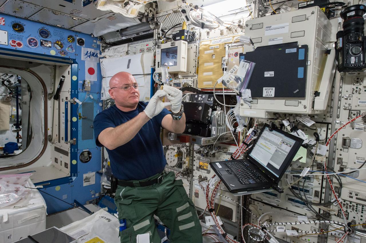 iss043e124213 (4/18/2015) --- NASA astronaut Scott Kelly is seen performing the Space Aging experiment using the Cell Biology Experiment Facility (CBEF) rack in the Japanese Experiment Module (JEM) aboard the International Space Station (ISS). The purpose of the experiment is to study the effects of weightlessness in space flight on the aging of the C. elegans roundworm, a model organism for a range of biological studies. Microgravity causes a number of physiological changes, like heart and bone deconditioning, involving mechanisms that are poorly understood and may affect the rate at which organisms and astronauts age. The Space Aging experiment will grow millimeter-long C. elegans roundworms in microgravity and compare their health and longevity with controlled specimens on Earth.