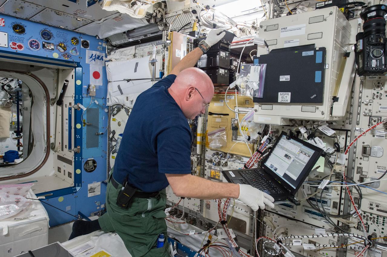 iss043e124225 (4/18/2015) --- NASA astronaut Scott Kelly is seen performing the Space Aging experiment using the Cell Biology Experiment Facility (CBEF) rack in the Japanese Experiment Module (JEM) aboard the International Space Station (ISS). The purpose of the experiment is to study the effects of weightlessness in space flight on the aging of the C. elegans roundworm, a model organism for a range of biological studies. Microgravity causes a number of physiological changes, like heart and bone deconditioning, involving mechanisms that are poorly understood and may affect the rate at which organisms and astronauts age. The Space Aging experiment will grow millimeter-long C. elegans roundworms in microgravity and compare their health and longevity with controlled specimens on Earth.