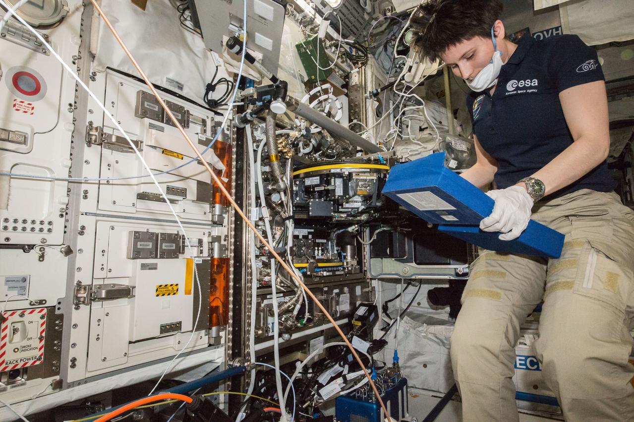 ISS043E127770 (04/14/2015) --- ESA (European Space Agency) astronaut Samantha Cristoforetti  of Expedition 43 on the International Space Station works to remove a water removal reservoir on Apr.14, 2015. She and her crewmates also were removing all four European Modular Cultivation System rotor based life support systems to pack for their return to Earth on the upcoming SpaceX-6 spacecraft.