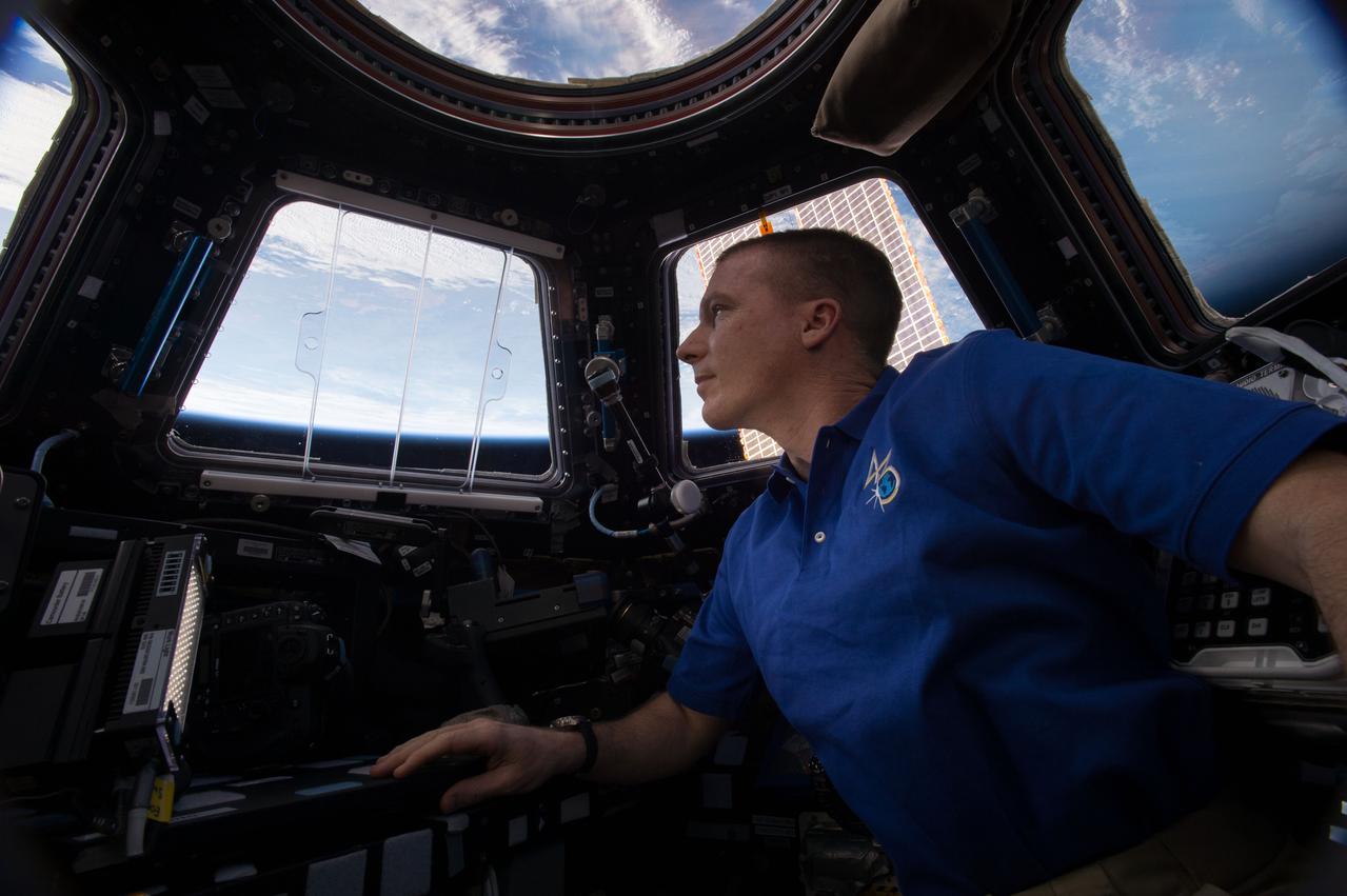 NASA astronaut Terry Virts of Expedition 43 on the International Space Station checks the remote control Canadarm2 on Apr.26, 2015. The Canadarm 2 is used to grapple arriving spacecraft and moving them to their docking ports.