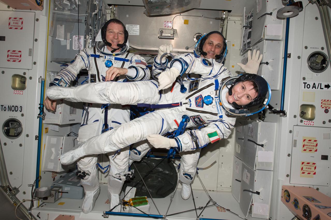ISS043E174193 (05/06/2015) --- NASA astronaut Terry Virts (left) Commander of Expedition 43 on the International Space Station along with crewmates Russian cosmonaut Anton Shkaplerov (center) and ESA (European Space Agency) astronaut Samantha Cristoforetti on May 6, 2015 perform a checkout of their Russian Soyuz spacesuits in preparation for the journey back to Earth.