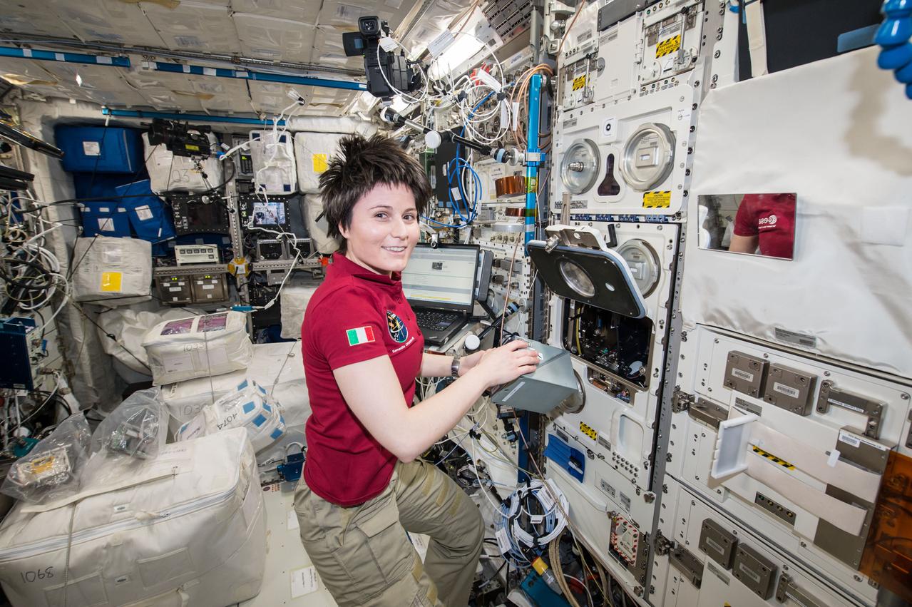 iss043e181042 (May 8, 2015) --- European Space Agency (ESA) astronaut Samantha Christoforetti prepares the TripleLux-A experiment for return on SpaceX's Dragon cargo craft. The TripleLux-A experiment studies the effects of the spaceflight conditions on immune suppresion in mice, which will help scientists understand the effects of radiation and microgravity on the human immune system in space.