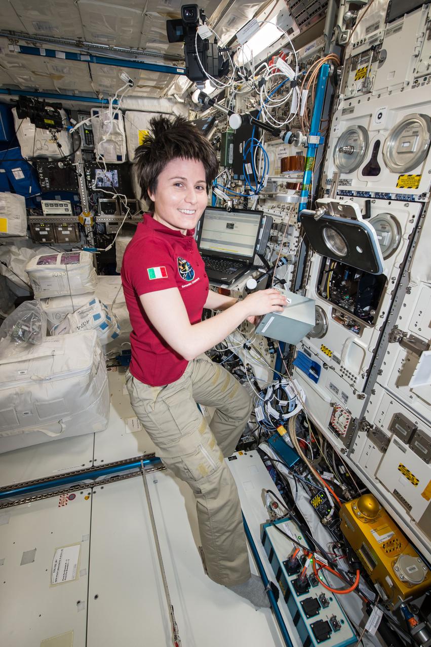 ISS043E181043 (05/08/2015) --- ESA (European Space Agency) astronaut Samantha Cristoforetti prepares the TripleLux-A experiment for return on SpaceX’s Dragon cargo craft. TripleLux-A is investigating immune suppression in space as understanding such risks is essential in maintaining the health and performance of crew members during long-duration missions.