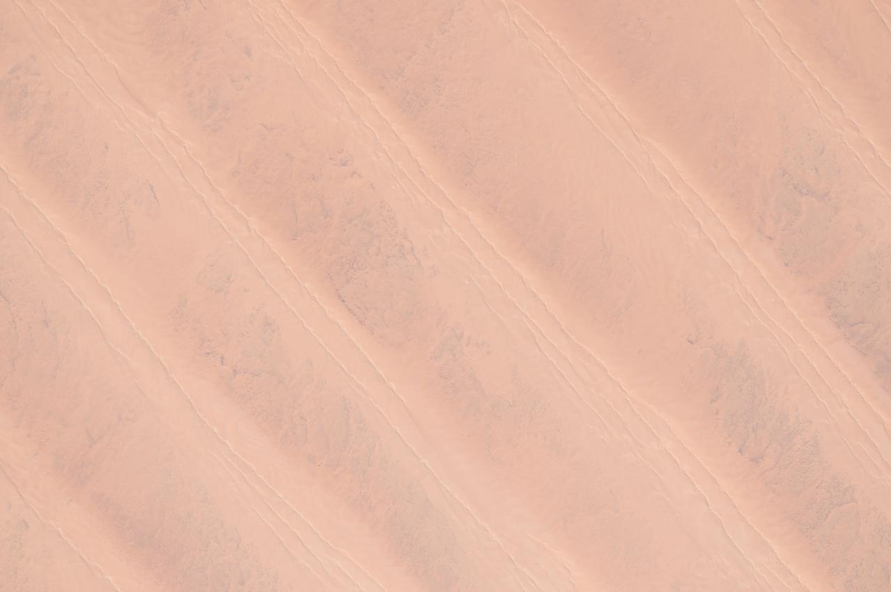 ISS043182398 (05/08/2015) --- Another view of the northern African Great Sand Sea, Libyan Desert and western Egypt with orange parallel dunes taken on May 8th 2015 by NASA astronaut Scott Kelly on the International Space Station.