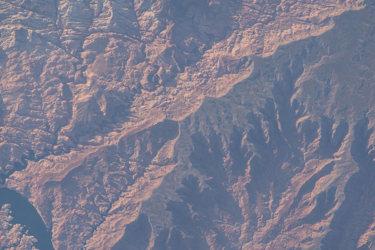 ISS043E182476 (05/08/2015) ---The US rugged southern Utah area is highlighted in this image captured by NASA astronaut Scott Kelly from the International Space Station May, 8th, 2015.  The area shown is the Forbidden Canyon, Rainbow Plateau and San Juan River.