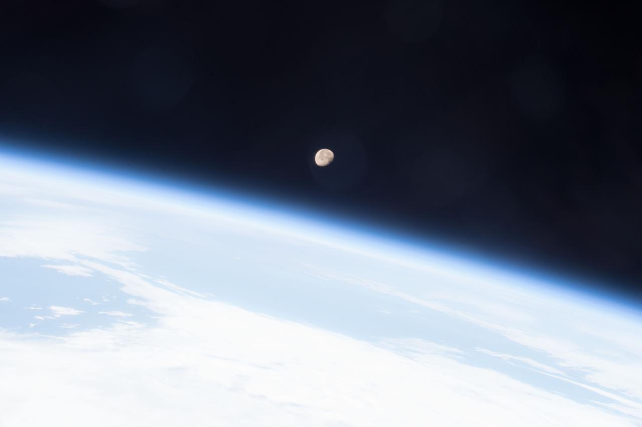 ISS043E200058 (05/07/2015) --- The Moon shines brightly on planet Earth's horizon in this image snapped from the International Space Station May 7, 2015 by the crew of Expedition 43 led by Commander Terry Virts, NASA astronaut.