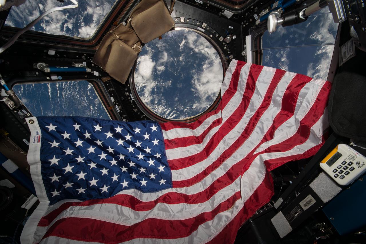 View of flag celebrating Flag Day in the Cupola Module.  Photo was taken during Expedition 44.