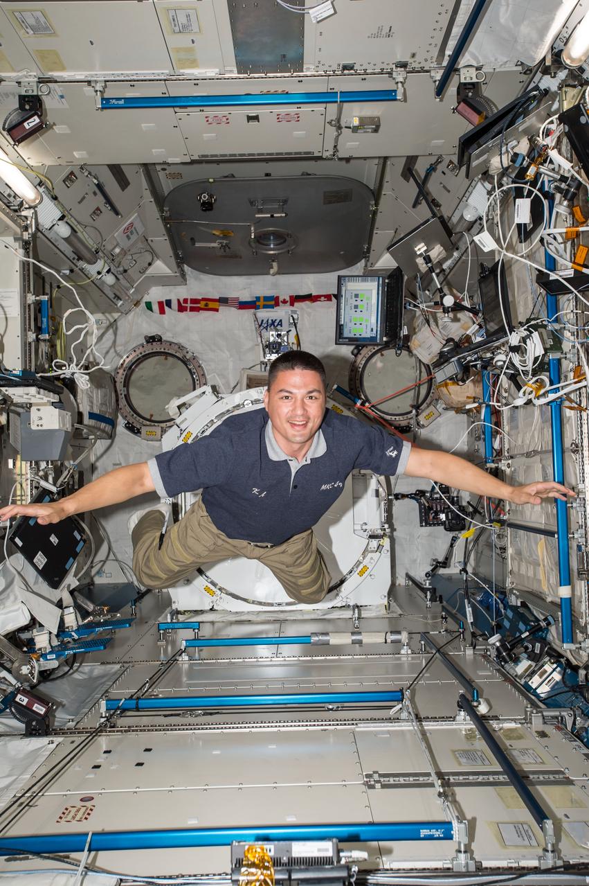 View of astronaut Kjell Lindgren flying in the Kibo module of the ISS. Sent as part of Twitter message: It's already been a week! Time is flying...and so am I!