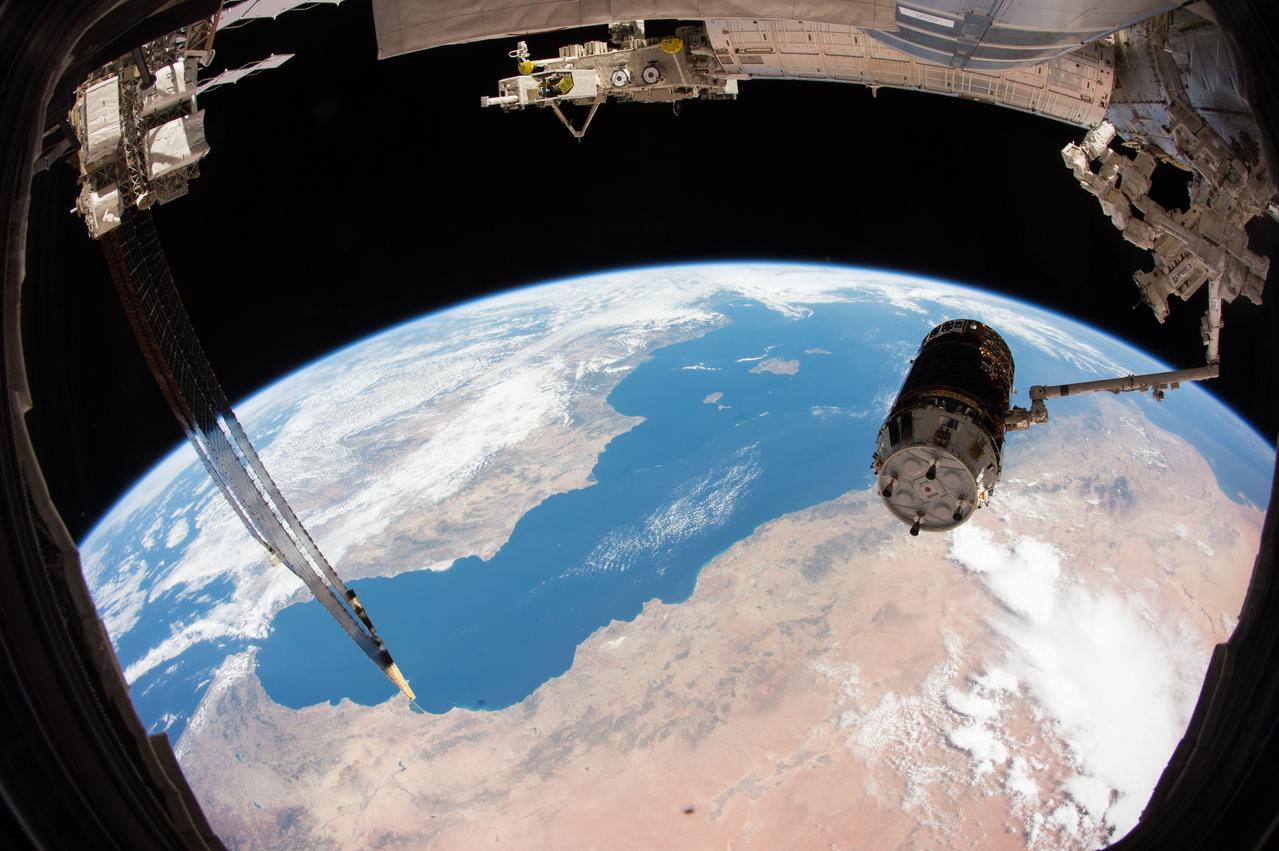 iss044e065321 (Aug. 24, 2015) --- JAXA's (Japan Aerospace Exploration Agency) H-II Transfer Vehicle-5, also known as the "Kounotori," is pictured during Expedition 44 in the grips of the International Space Station's Canadarm2 robotic arm as the orbital complex orbited above north Africa and across the Mediterranean Sea.