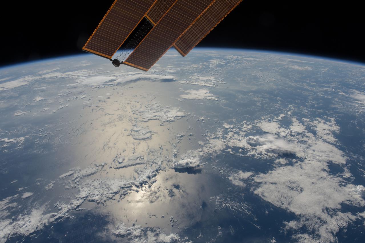 ISS044e077073 (08/29/2015) --- The Sun shines brightly off the water of our planet Earth to start the day off for our astronauts and cosmonauts aboard the International Space Station. Science projects, repairs and maintenance fill the days on board the station as it fly's around the Earth.