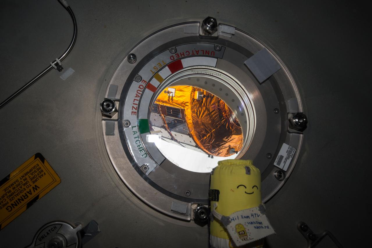 ISS045E033653 (09/28/2015) --- The Japan Aerospace Exploration Agency (JAXA) Kounotori 5 H-II Transfer Vehicle (HTV-5) is seen through a window shortly before release from the International Space Station’s robotic arm, Canadarm2. The cargo vehicle was berthed to the orbiting laboratory for five weeks until it was released on Sept. 28, 2015. HTV-5 delivered almost five tons of hardware and supplies.