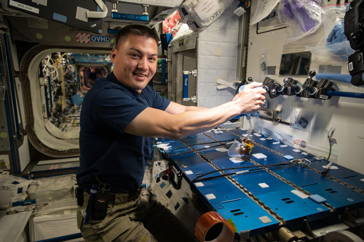 iss045e035321 (9/29/2015) --- NASA astronaut Kjell Lindgren celebrates International Coffee Day aboard the International Space Station (ISS) with his first hand-brewed cup of coffee in space, brewed using the Capillary Beverage Cup.